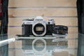 Canon (67090) AE-1 35mm Film SLR Camera w/FD 50mm f1.8 S.C. Lens, Used (Renewed)