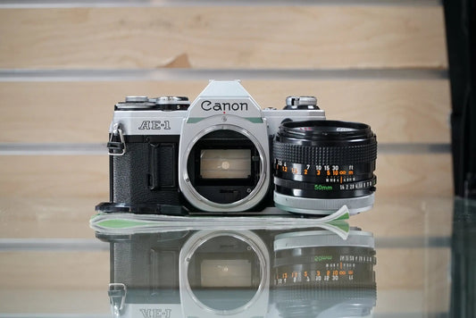 Canon (30280) AE-1 35mm Film SLR Camera w/FD 50mm f1.4 S.S.C. Lens, Silver, Used (Renewed)