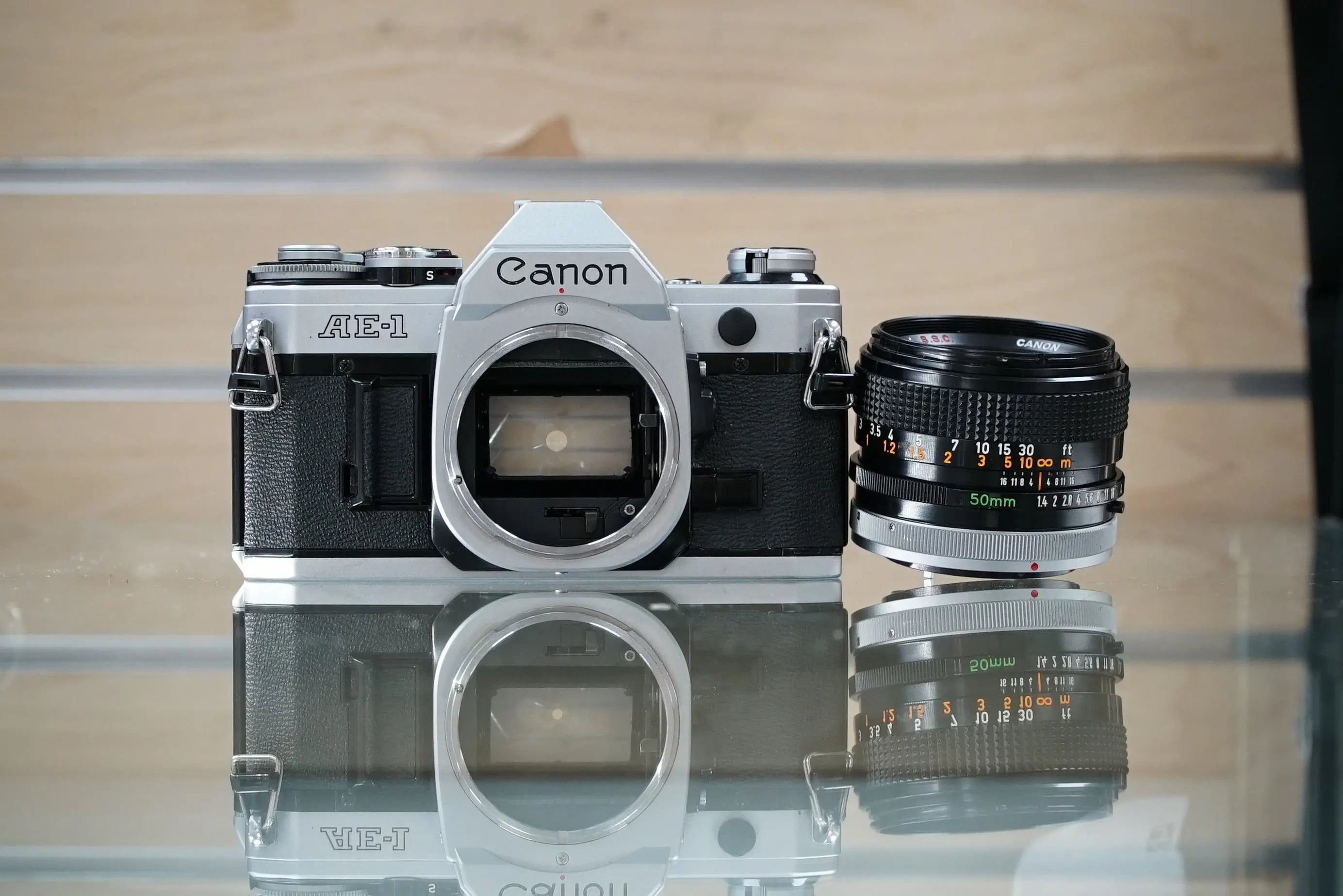 Canon (30280) AE-1 35mm Film SLR Camera w/FD 50mm f1.4 S.S.C. Lens, Silver, Used (Renewed)