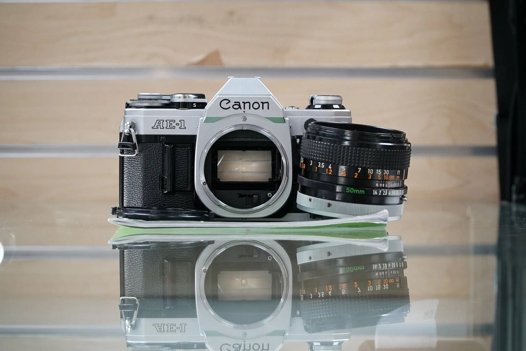 Canon (12229) AE-1 35mm Film SLR Camera w/FD 50mm f1.4 S.S.C. Lens, Used (Renewed)