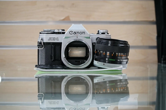 Canon (12229) AE-1 35mm Film SLR Camera w/FD 50mm f1.4 S.S.C. Lens, Used (Renewed)