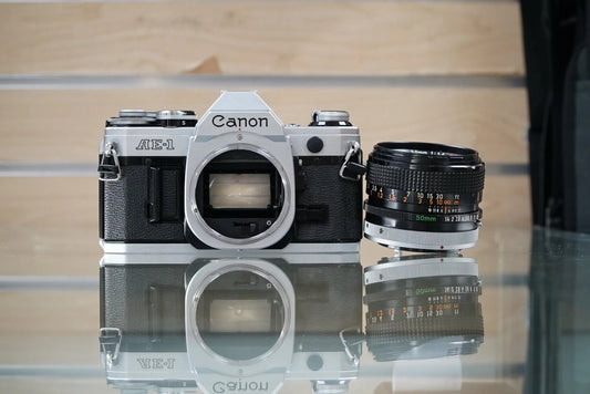 Canon (12229) AE-1 35mm Film SLR Camera w/FD 50mm f1.4 S.S.C. Lens, Used (Renewed)