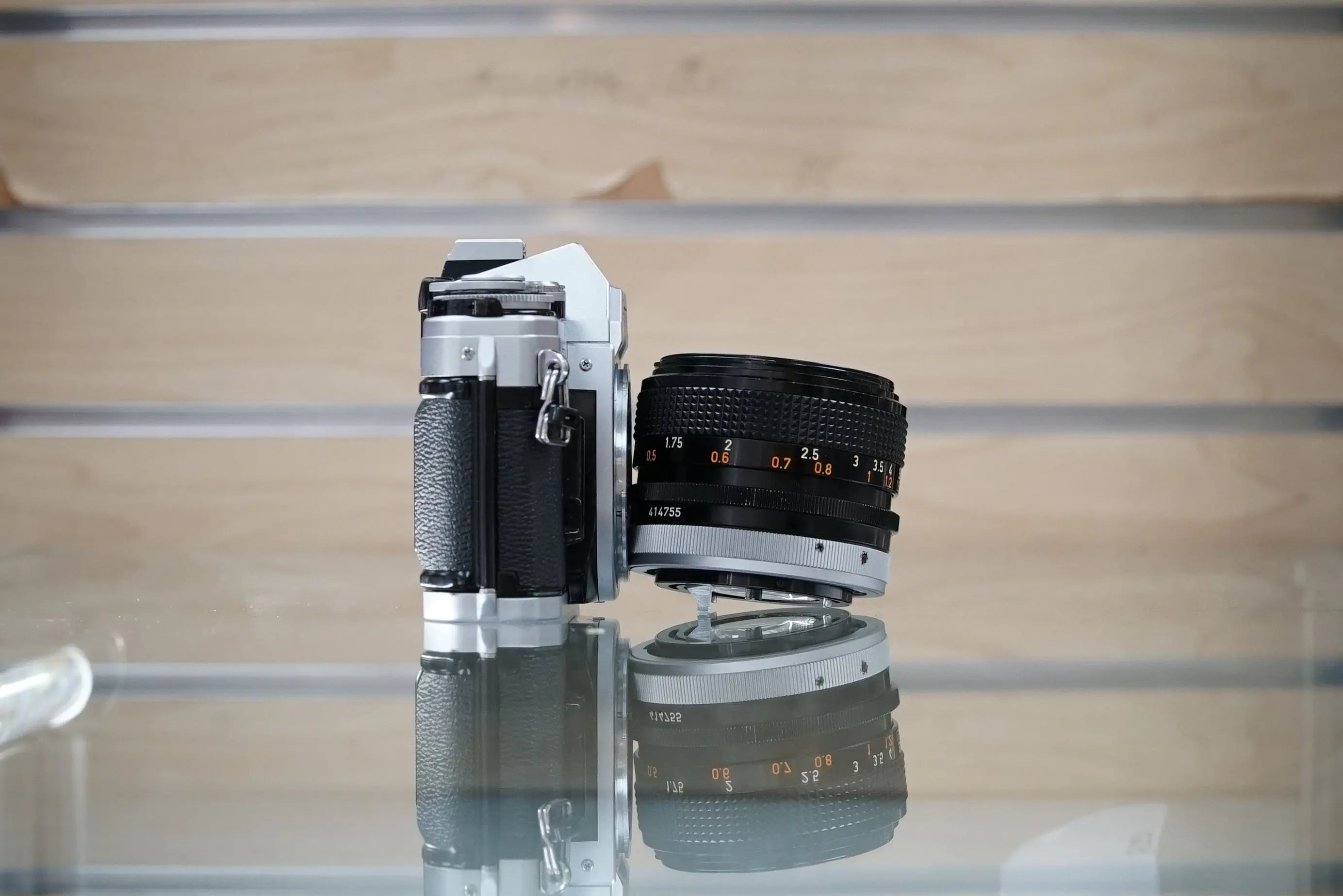 Canon (12229) AE-1 35mm Film SLR Camera w/FD 50mm f1.4 S.S.C. Lens, Used (Renewed)