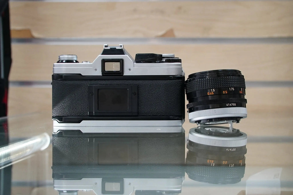 Canon (12229) AE-1 35mm Film SLR Camera w/FD 50mm f1.4 S.S.C. Lens, Used (Renewed)
