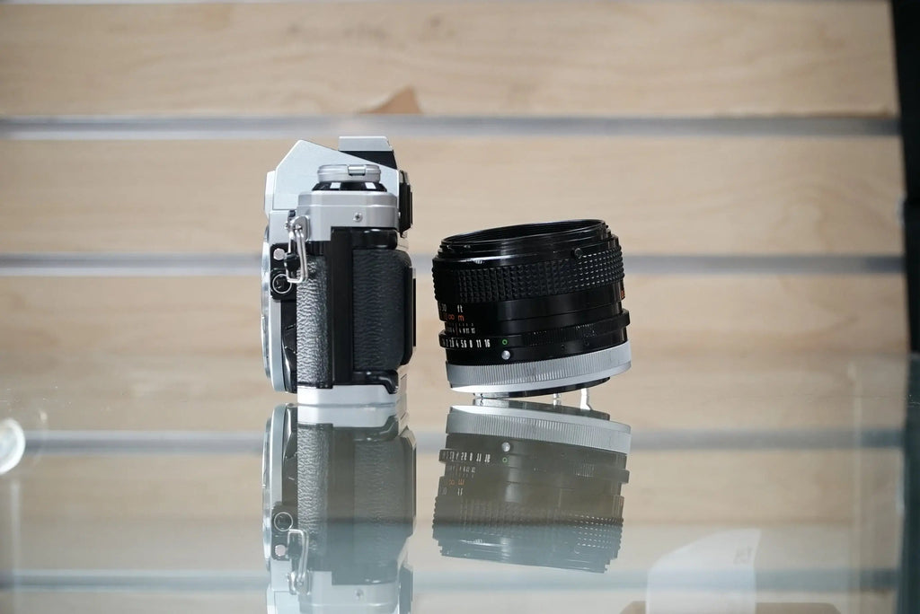 Canon (12229) AE-1 35mm Film SLR Camera w/FD 50mm f1.4 S.S.C. Lens, Used (Renewed)