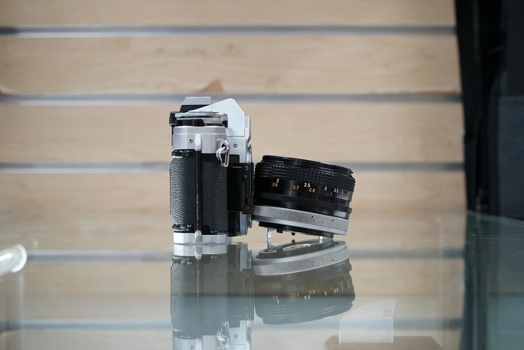 Canon (08640) AE-1 35mm Film SLR Camera w/FD 50mm f1.8 S.C. Lens, Used