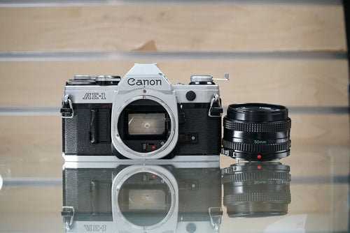 Canon (11723) AE-1 35mm Film SLR Camera w/FD 50mm f1.8 S.C. Lens, Used