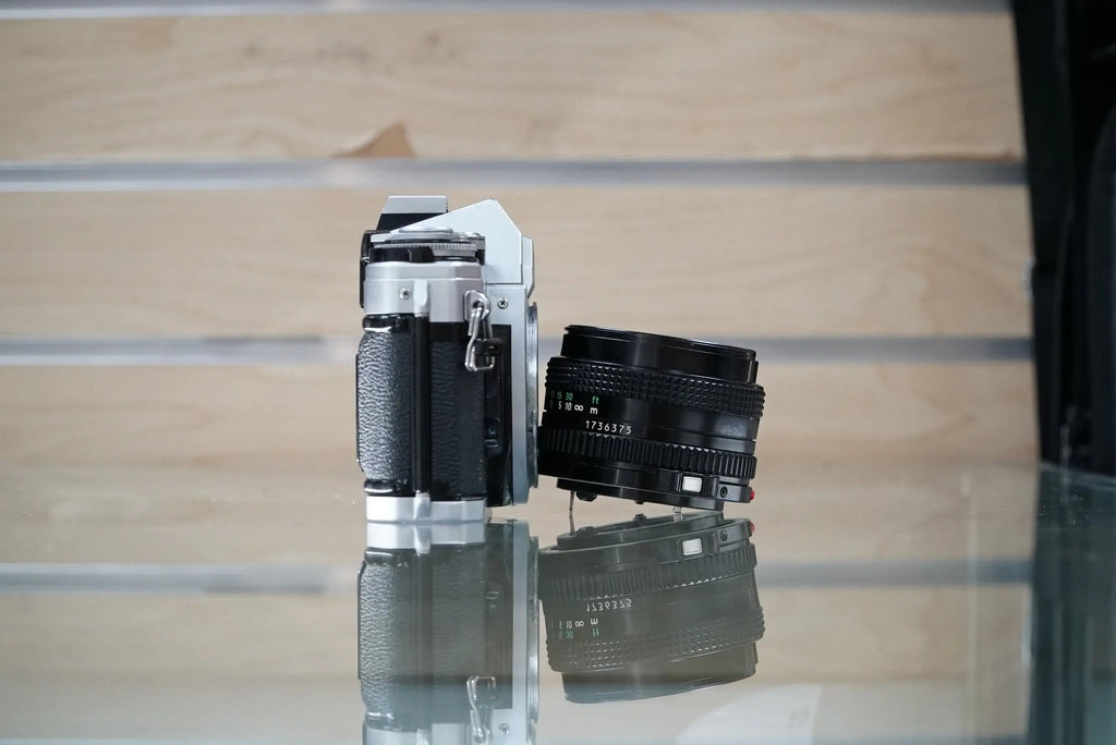 Canon (11723) AE-1 35mm Film SLR Camera w/FD 50mm f1.8 S.C. Lens, Used
