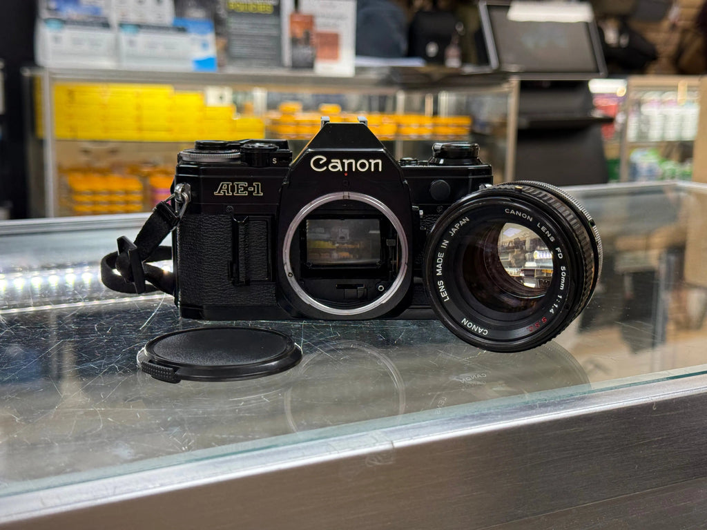 Canon AE1-50F14-16564 AE-1 35mm Film Camera (Black) W/FD 50mm f/1.4 S.S.C. Lens, Used CANON