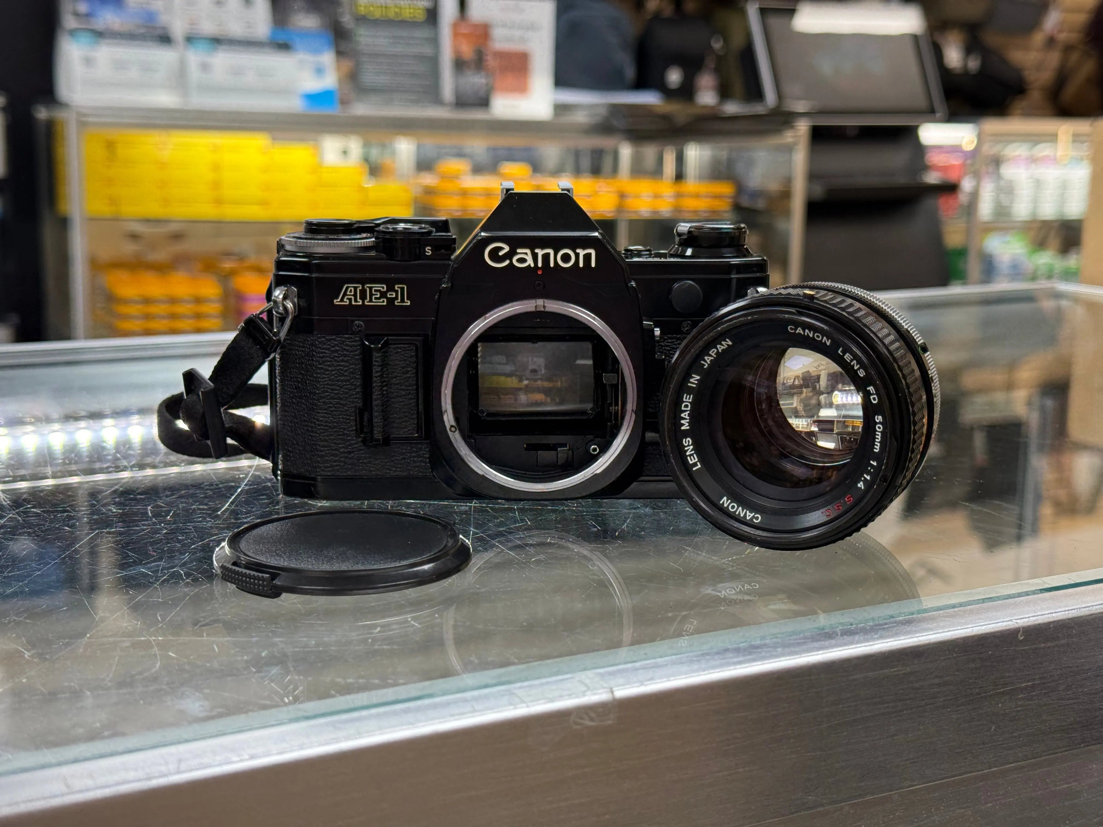 Canon AE1-50F14-16564 AE-1 35mm Film Camera (Black) W/FD 50mm f/1.4 S.S.C. Lens, Used CANON