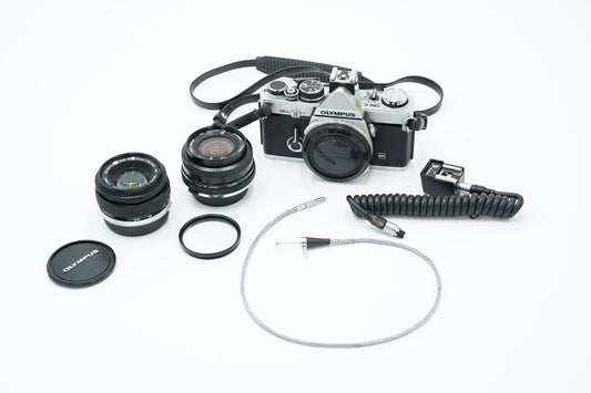 Olympus OM2N/95712 OM-2n Film Camera + Zuiko 50mm f/1.8 Lens + Vivitar 28mm f/2.8 + Shutter Release Cable, Used